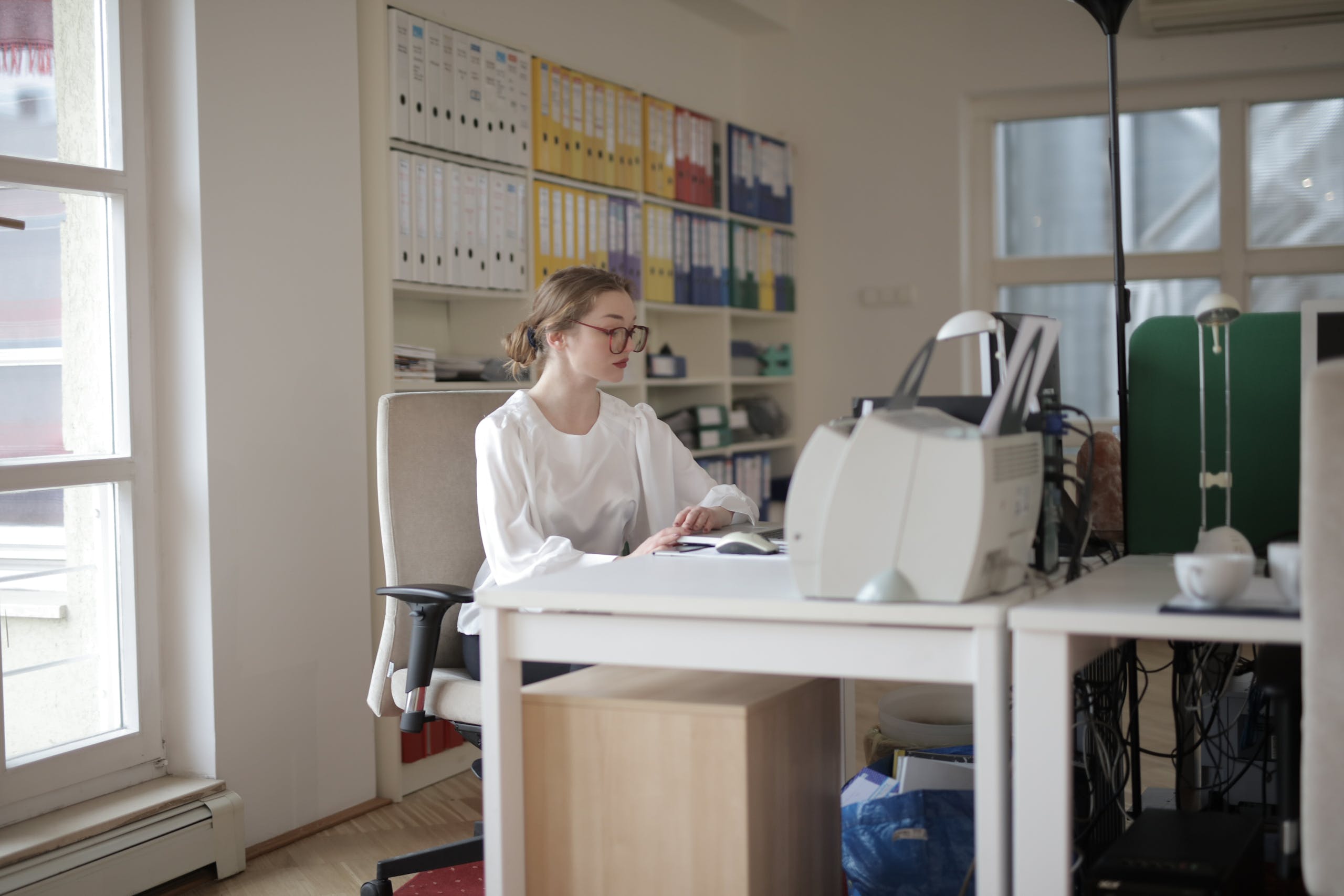 Working Woman in White Long Sleeve Shirt