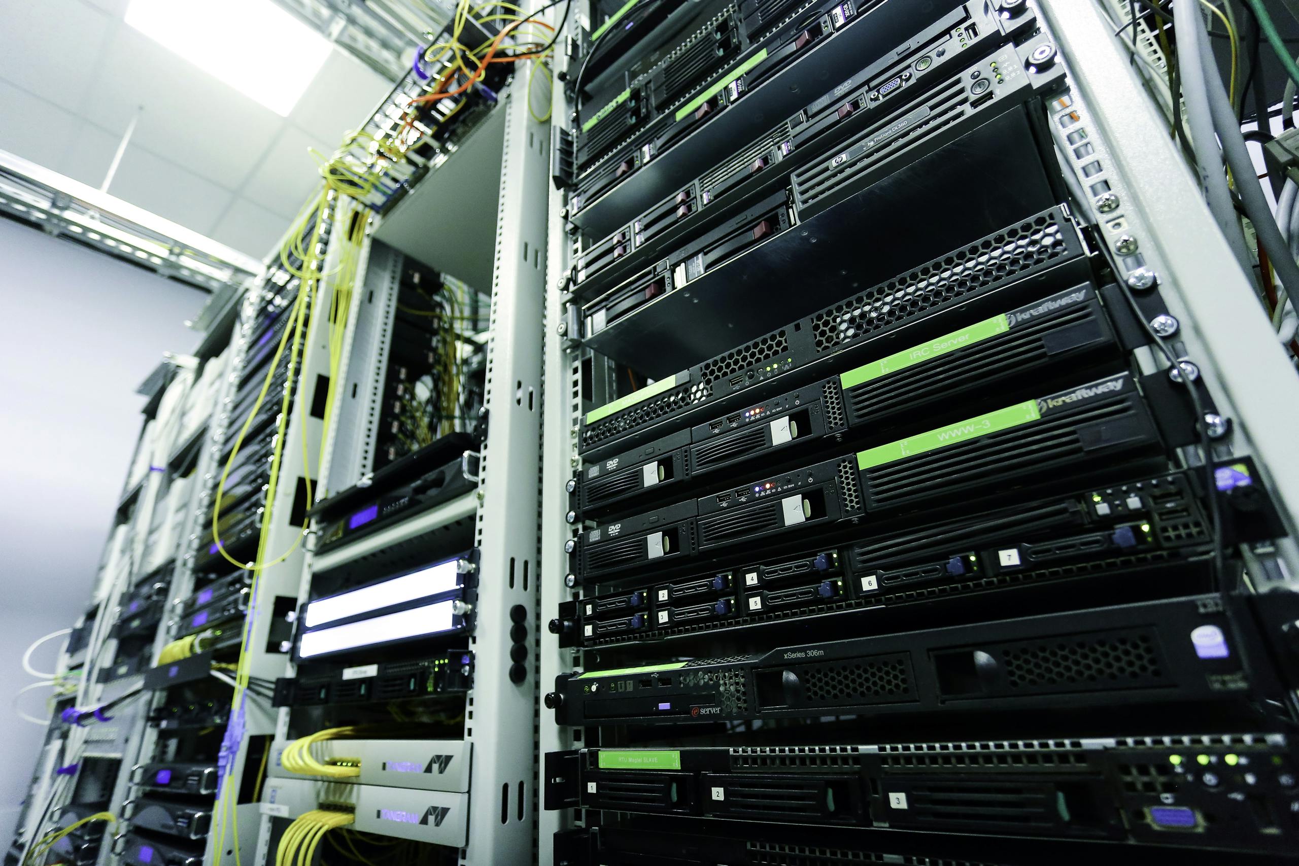 Data center racks containing multiple servers, network appliances, and security appliances.